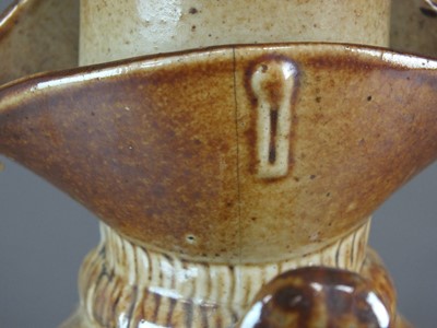 Lot 288 - A Brampton-type salt glaze toby jug and cover