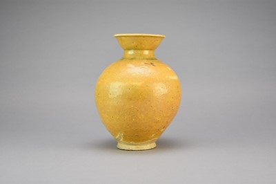 Lot 5 - A Chinese porcelaneous ochre glazed jar, probably Tang Dynasty