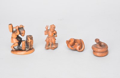 Lot 348 - Two Japanese carved wood netsuke and two okimono