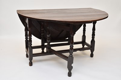 Lot 650 - An early 18th century oak gateleg table