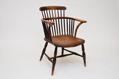 Lot 655 - A 19th century elm and beech comb-back type Windsor armchair