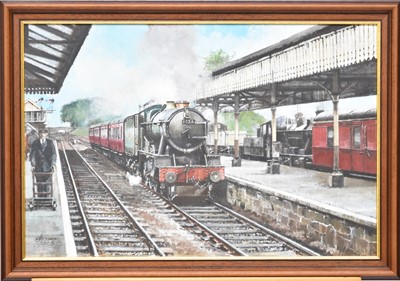 Lot 549 - Bernard Jones (active circa 1996), a steam locomotives in a station, '1026', oil on canvas