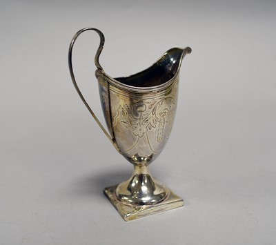 Lot 13 - A George III silver helmet cream jug
