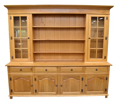 Lot 493 - A large light oak dresser cabinet by Venables Brothers, Cheswardine