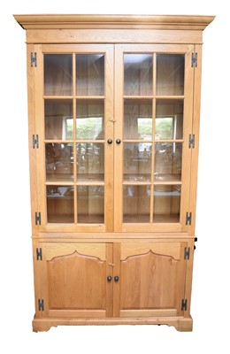 Lot 608 - A large light oak display cabinet by Venables Brothers, Cheswardine