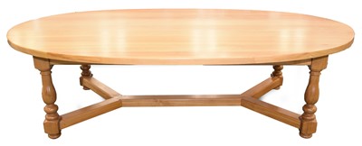 Lot 601 - A large light oak oval dining table by Venables Brothers, Cheswardine