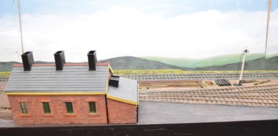 Lot 222 - A large 0-gauge model of a railway station, extending to sidings and the edge of a town