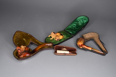 Lot 509 - A group of Meerschaum pipes and a cheroot holder