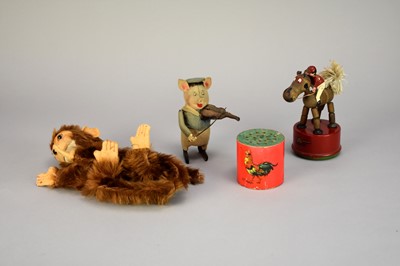 Lot 435 - An early 20th century Schuco pig, a Triang jockey and a monkey glove puppet (4)