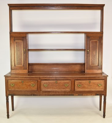 Lot 445 - An early 19th century oak, crossbanded dresser, Shropshire