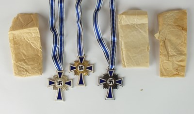 Lot 175 - A set of three German Third Reich Mother's Crosses, ex Deschler hoard.