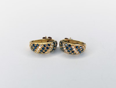 Lot 102 - A pair of diamond and sapphire earrings