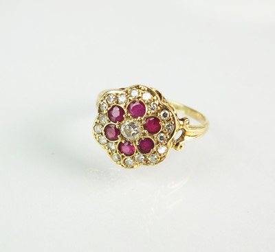 Lot 166 - A ruby and diamond floral cluster ring