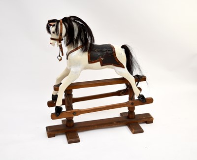 Lot 434 - A small British painted wood rocking horse