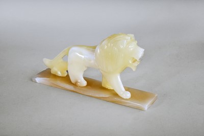 Lot 405 - An art deco style onyx figure of a lion