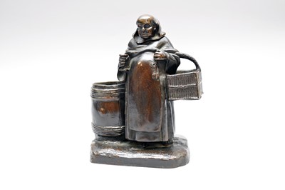 Lot 241 - A Continental bronze figural monk taper and match holder