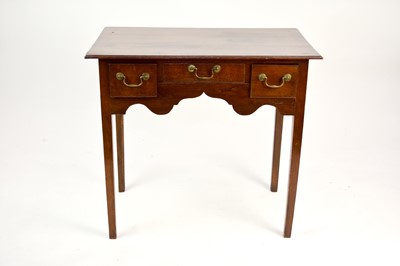 Lot 553 - An early-mid 19th century oak lowboy