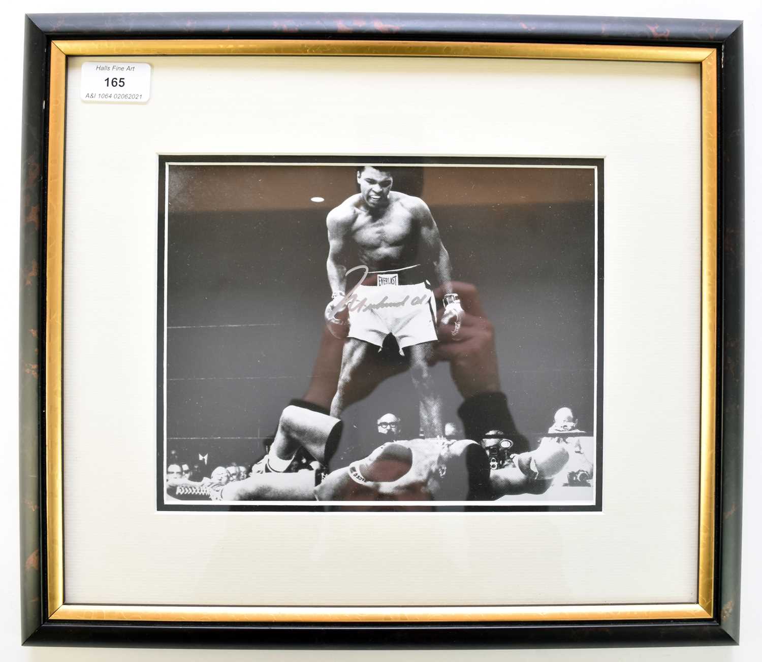 Lot 165 - MUHAMMED ALI, Signed photograph. The famous...