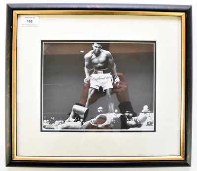 Lot 165 - MUHAMMED ALI, Signed photograph.  The famous...