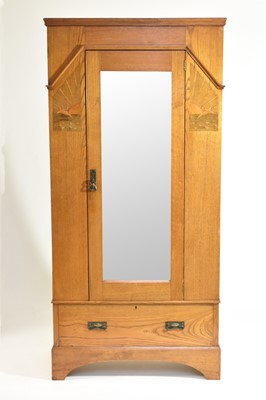 Lot 542 - An early 20th century oak and marquetry art nouveau single wardrobe
