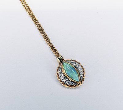 Lot 104 - An 18ct gold opal and diamond pendant on chain