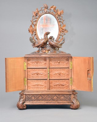 Lot 325 - A late 19th century ‘Black Forest’ table cabinet, Brienz