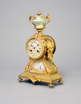 Lot 333 - A late 19th century French, porcelain mounted, gilt metal mantel clock