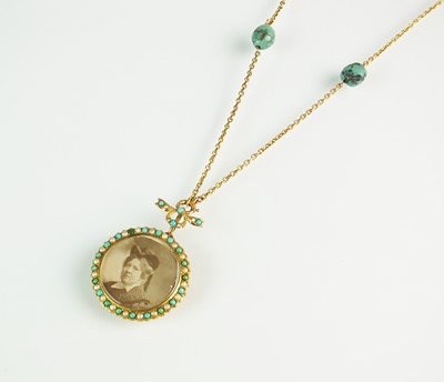 Lot 144 - A turquoise and split pearl circular locket pendant
