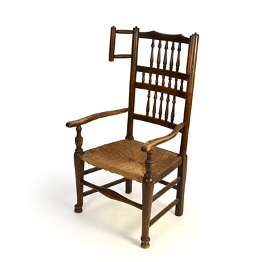 Lot 519 - A Lancashire ash spindle-back open armchair