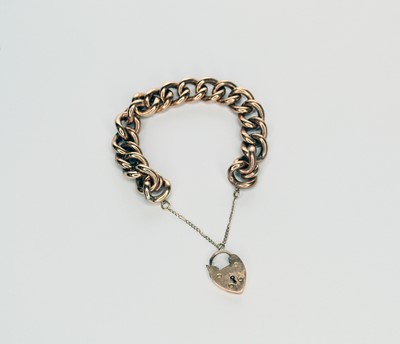 Lot 55 - A rose metal hollow curb link bracelet