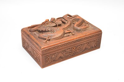 Lot 213 - A Chinese carved hardwood cigarette box