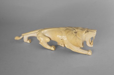 Lot 345 - A Japanese carved ivory okimono of a lion