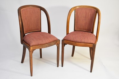 Lot 521 - A set of four French stripped walnut side chairs upholstered by Mark Gillette