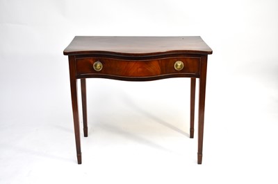 Lot 513 - A George III mahogany serpentine side table