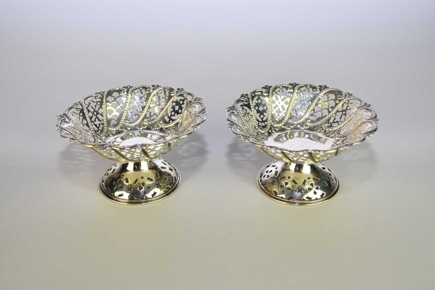 Lot 31 - A pair of silver pierced pedestal bon bon dishes