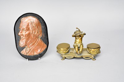 Lot 381 - A cast brass desk standish and a copper portrait plaque, possibly Abraham Lincoln