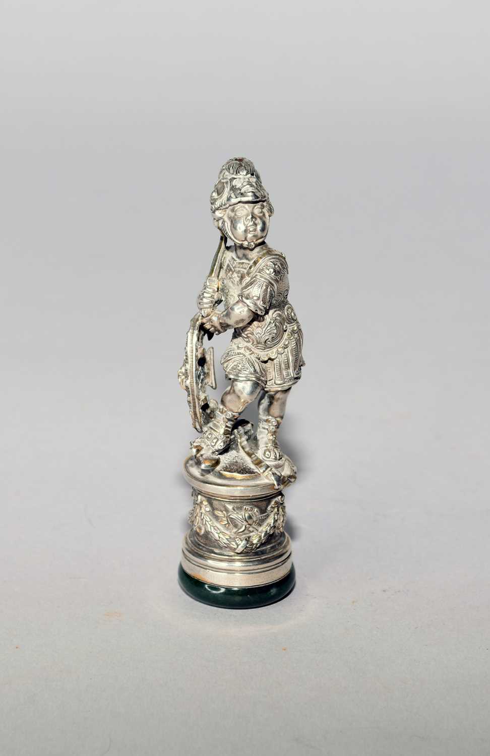 Lot 34 - A Neo-classical style white metal figural desk seal