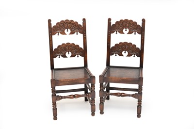 Lot 330 - A set of four 17th century style carved oak side chairs