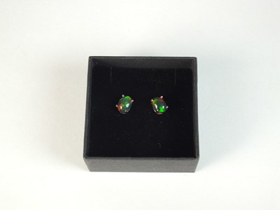 Lot 112 - A pair of black opal studs earrings