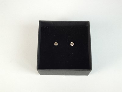 Lot 126 - A pair of platinum brilliant cut diamond stud earrings