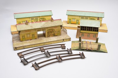 Lot 225 - A large collection of O-gauge railway track and trackside buildings