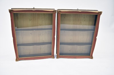 Lot 564 - A pair of Louis XV style glazed hanging display cabinets