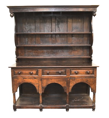 Lot 325 - An 18th century and later stained oak and elm dresser