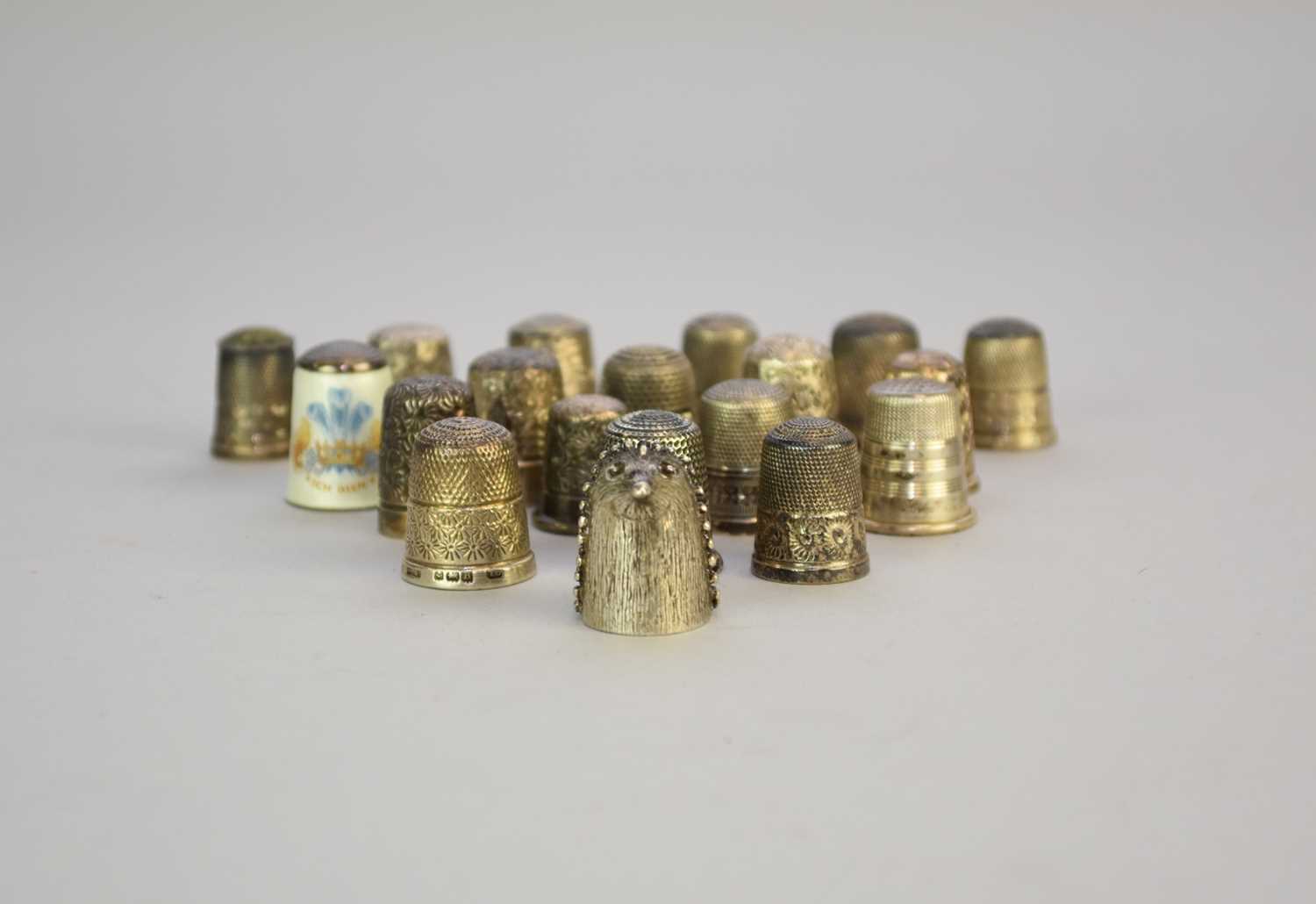 Lot 24 - A collection of nineteen silver thimbles
