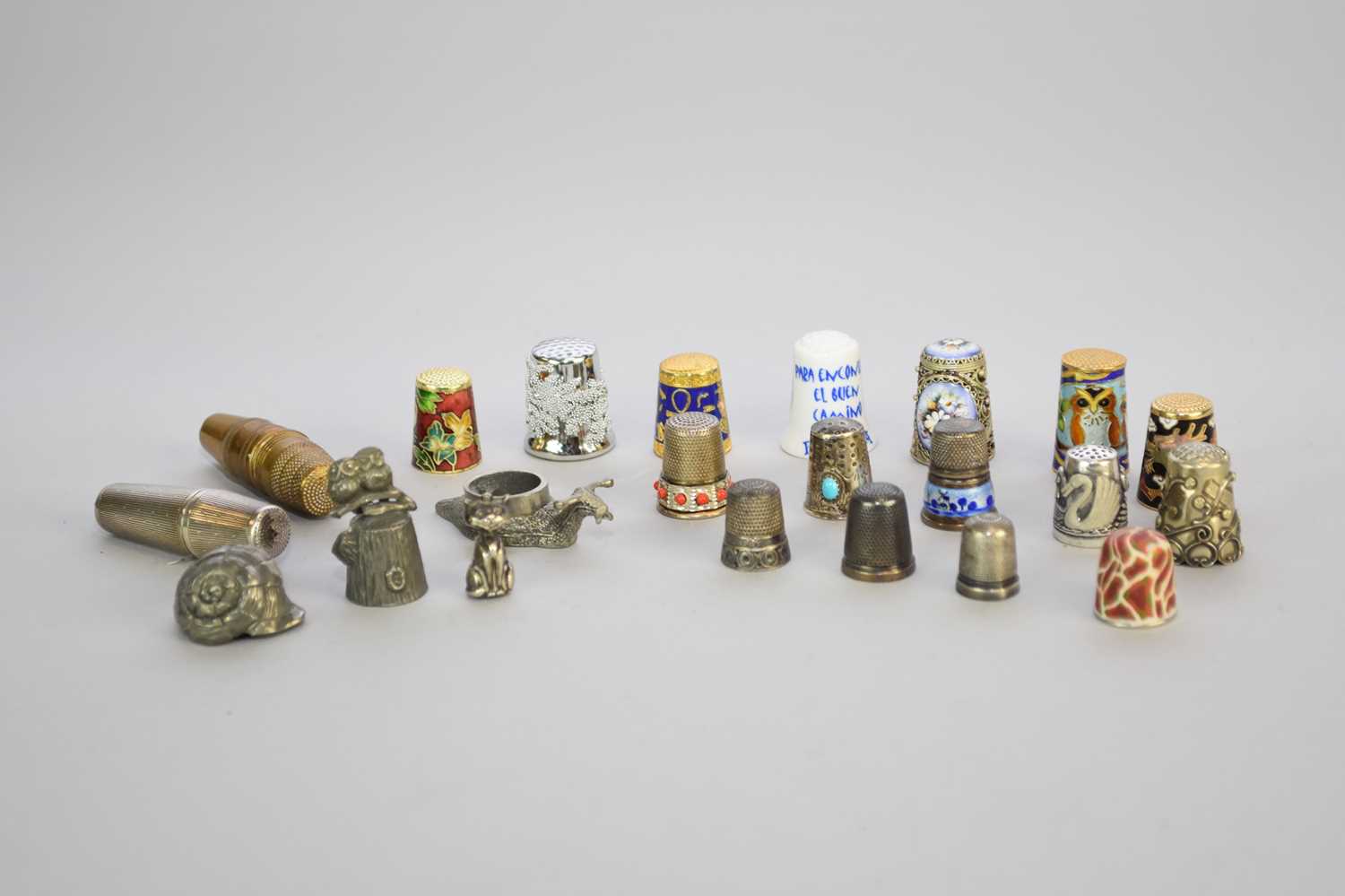 Lot 21 - A collection of white metal, enamel, gilt and ceramic thimbles