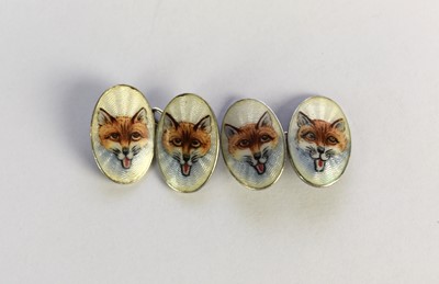 Lot 48 - A pair of white metal and enamel cufflinks
