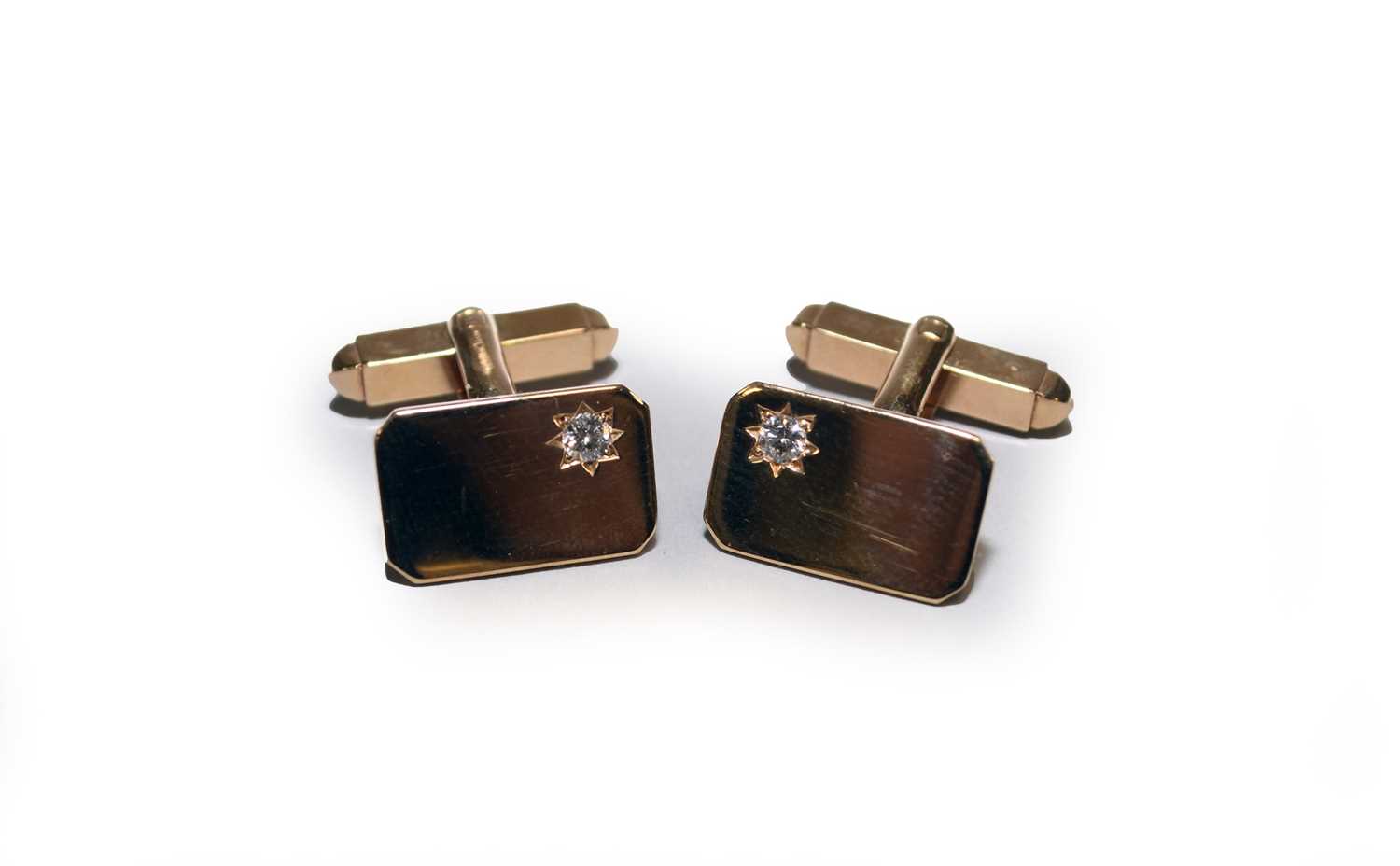 Lot 40 - A pair of yellow metal diamond set cufflinks