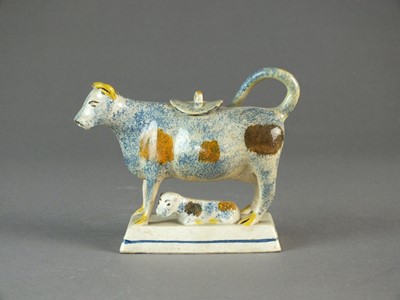 Lot 290 - A Staffordshire prattware cow creamer