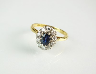 Lot 158 - A sapphire and diamond cluster ring