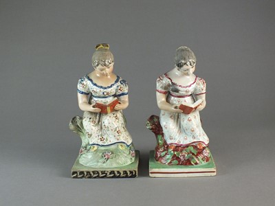 Lot 293 - Two similar Staffordshire pearlware figures of reading maidens, early 19th century